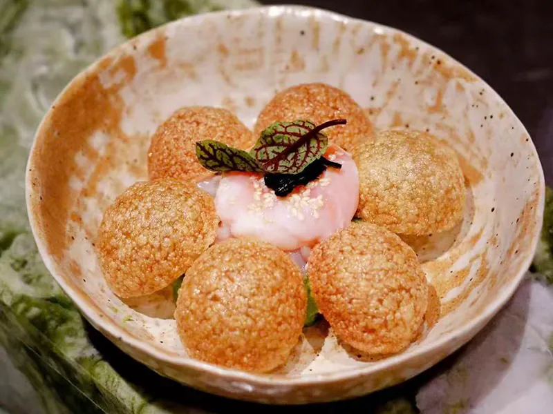 Crispy rice balls with onsen egg & sweet Hokkaido shrimp at Koi Sushi, a Japanese Restaurant in Gaithersburg